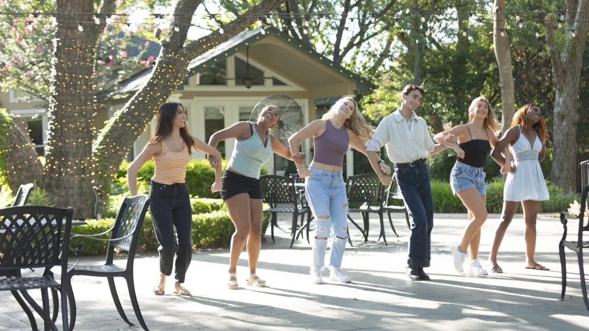 Dancers performing a surprise flash mob marriage proposal